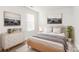 Serene bedroom features a large bed, monochromatic decor, and an artful collection of decor at 1686 Scarbrough Sw Cir, Concord, NC 28025