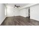 Spacious living room with hardwood floors and staircase to the second level at 1686 Scarbrough Sw Cir, Concord, NC 28025
