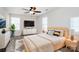 Cozy main bedroom with a ceiling fan, recessed lighting, and large windows with wood bedside tables at 1686 Scarbrough Sw Cir, Concord, NC 28025