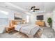 Inviting main bedroom with tray ceiling, ceiling fan, and neutral decor at 1686 Scarbrough Sw Cir, Concord, NC 28025