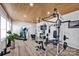 Home gym with wood ceiling featuring exercise machines and free weights with a large plant at 188 Gilbert Rd, Lincolnton, NC 28092