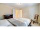 Cozy bedroom featuring neutral walls, a patterned quilt, and modern furnishings at 201 Limerick Dr, Matthews, NC 28104