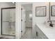 Modern bathroom featuring a walk-in shower with glass enclosure, a white vanity and sleek fixtures at 2016 Sadler Woods Ln, Charlotte, NC 28214