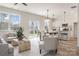 Bright open floorplan featuring a spacious living room, dining area, and kitchen with natural light at 2016 Sadler Woods Ln, Charlotte, NC 28214