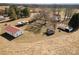 Aerial view of a rural property with several buildings and large trees at 202 Deitz Rd, Statesville, NC 28625