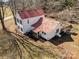 Aerial view of a two-story home with a red roof and mature trees at 202 Deitz Rd, Statesville, NC 28625