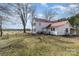 View of the backyard of the home showcasing lots of land and partial fencing at 202 Deitz Rd, Statesville, NC 28625