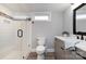 Modern bathroom featuring a glass-enclosed shower, gray vanity, and stylish fixtures at 202 Deitz Rd, Statesville, NC 28625