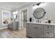 Bright bathroom features dual sinks, mirrors, and contemporary fixtures at 202 Deitz Rd, Statesville, NC 28625