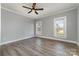 Inviting bedroom with hardwood floors, a ceiling fan, and windows that bring in lots of natural light at 202 Deitz Rd, Statesville, NC 28625