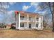 Two-story home with a red roof, double porches supported by columns, and dark shutters at 202 Deitz Rd, Statesville, NC 28625