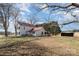 Charming two-story home with a red roof, white siding, and a fenced yard at 202 Deitz Rd, Statesville, NC 28625