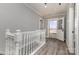 Bright hallway features wood-look floors and beadboard walls leading to the home's exterior at 202 Deitz Rd, Statesville, NC 28625