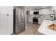 Well-equipped kitchen boasts stainless steel appliances, white cabinets, and a seamless flow for cooking and gatherings at 202 Deitz Rd, Statesville, NC 28625