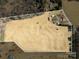 Aerial view of a large lot with a farmhouse and multiple outbuildings at 202 Deitz Rd, Statesville, NC 28625