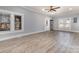 Bright living room with large windows and hardwood floors offers an inviting space for relaxation and entertainment at 202 Deitz Rd, Statesville, NC 28625