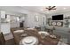 An open-concept living and dining area features neutral tones, modern finishes, and a seamless flow for entertaining at 202 Deitz Rd, Statesville, NC 28625