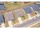 Aerial shot of a neighborhood featuring well-maintained homes, green lawns, and a quiet residential street at 215 Pintail Dr, Monroe, NC 28110