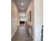 Inviting home hallway with elegant wainscoting and view to the living room at 215 Pintail Dr, Monroe, NC 28110