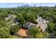 Aerial view of gray duplex near downtown, overlooking lush trees at 2230 Revolution Park Dr, Charlotte, NC 28208
