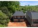Back aerial view of a gray duplex with sliding doors and backyard space at 2230 Revolution Park Dr, Charlotte, NC 28208