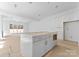 Modern kitchen island with drawers and cabinets, complemented by white cabinetry at 2230 Revolution Park Dr, Charlotte, NC 28208