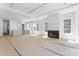 Open floor plan with fireplace, bright windows, and view into the kitchen area at 2230 Revolution Park Dr, Charlotte, NC 28208