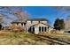 Spacious home with a brick and siding exterior featuring an enclosed sunroom at 2307 Woodleaf Dr, Gastonia, NC 28052