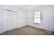Simple bedroom with double door closet and carpet at 234 Candle Nw Ct, Concord, NC 28027