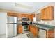 Galley kitchen with stainless steel appliances and ample cabinet space at 234 Candle Nw Ct, Concord, NC 28027
