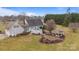 Aerial shot of a house featuring a backyard with a gazebo, patio, and well-maintained lawn at 2370 Old Mountain Rd, Statesville, NC 28625