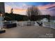 Spacious back deck with white railings and a large wooden surface perfect for outdoor entertaining at 2370 Old Mountain Rd, Statesville, NC 28625