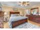 Bedroom with hardwood floors, large window, soft sunlight, and updated decor at 2370 Old Mountain Rd, Statesville, NC 28625