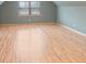 Spacious bonus room with laminate flooring, ample natural light, and plenty of room to roam at 2370 Old Mountain Rd, Statesville, NC 28625