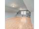 Large bonus room with wood laminate floors, a window AC unit, and great potential at 2370 Old Mountain Rd, Statesville, NC 28625
