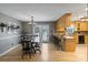Bright dining room with modern chandelier, wood floors, and access to the outdoor patio at 2370 Old Mountain Rd, Statesville, NC 28625