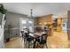 Bright dining room with modern chandelier, wood floors, and access to the outdoor patio and kitchen at 2370 Old Mountain Rd, Statesville, NC 28625