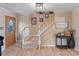 Inviting foyer with wood flooring, staircase, wood door with glass inset, and neutral paint at 2370 Old Mountain Rd, Statesville, NC 28625
