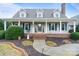 Beautiful two-story home with a covered front porch, neat landscaping, and classic architectural details at 2370 Old Mountain Rd, Statesville, NC 28625