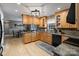 Well-equipped kitchen featuring wood cabinets, granite countertops, and stainless steel appliances at 2370 Old Mountain Rd, Statesville, NC 28625