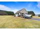View of the outbuilding with a covered area and a trailer on the spacious property at 2370 Old Mountain Rd, Statesville, NC 28625
