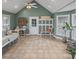 Bright sunroom features large windows, tile flooring, and flexible space for various activities at 2370 Old Mountain Rd, Statesville, NC 28625