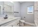 Modern bathroom featuring white vanity with new marble tile shower and backsplash at 2385 Kool Park Ne Rd # 2, Hickory, NC 28601