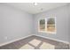 Simple bedroom with plush carpet, window, and light gray walls at 2385 Kool Park Ne Rd # 2, Hickory, NC 28601