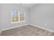 Cozy bedroom with neutral carpet and large window for natural light at 2385 Kool Park Ne Rd # 2, Hickory, NC 28601