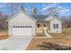 Charming, new construction, single-story home with white brick and a two-car garage at 2385 Kool Park Ne Rd # 2, Hickory, NC 28601
