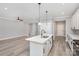 Open-concept kitchen with white cabinets, stainless steel appliances, and an island sink at 2385 Kool Park Ne Rd # 2, Hickory, NC 28601