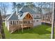 Exterior of home showing the back yard and outdoor deck with stairs at 2418 Lexington Approach Dr, Charlotte, NC 28262
