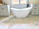 A freestanding bathtub and dual vanities create a luxurious spa-like experience in this bathroom at 2418 Lexington Approach Dr, Charlotte, NC 28262