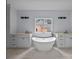 Bathroom featuring freestanding tub, double vanities, and tile floors at 2418 Lexington Approach Dr, Charlotte, NC 28262